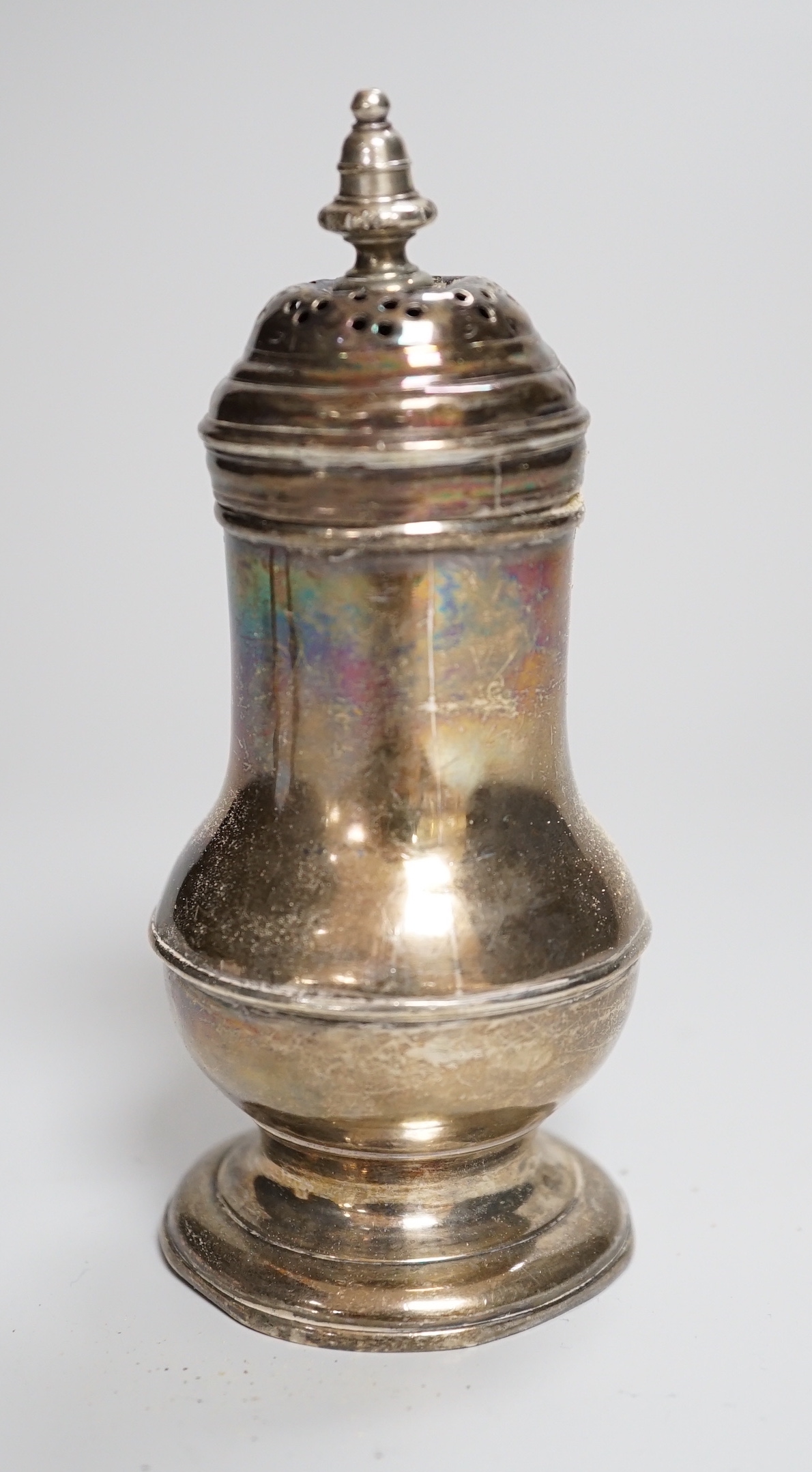 A George I silver bun shaped pepper, George Greenhill Jones, London, 1726, 10.8cm.